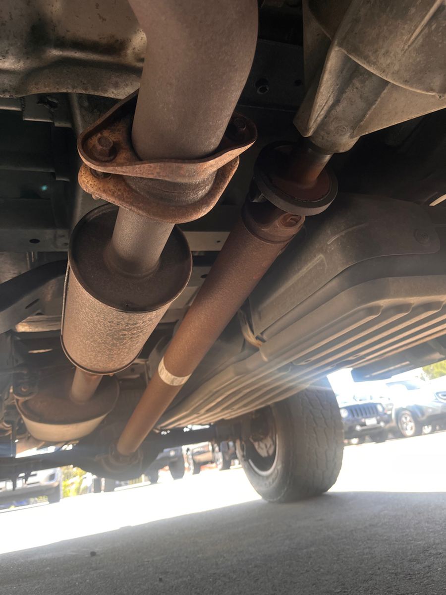 Underbody view of an exhaust pipe and catalytic converter