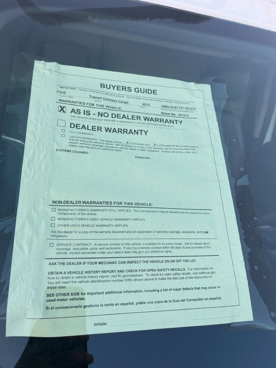 Federal Buyers Guide window sticker with the AS IS, NO DEALER WARRANTY box ticked