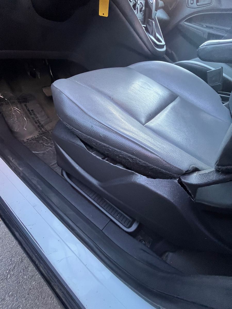 Driver seat in a cargo van with the side bolster worn through