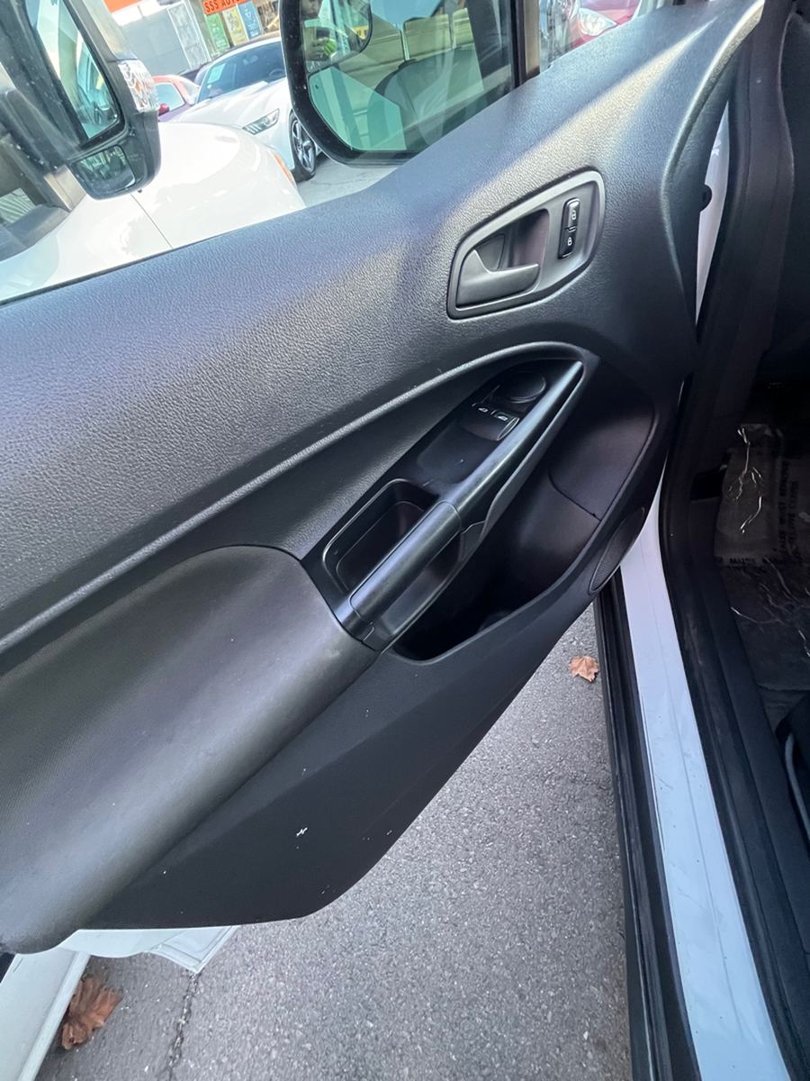 Driver door card, handle and window switches inside a cargo van