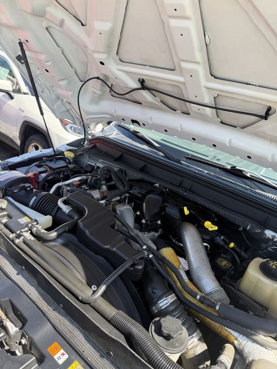 Engine bay of a diesel Ford Super Duty with the hood raised