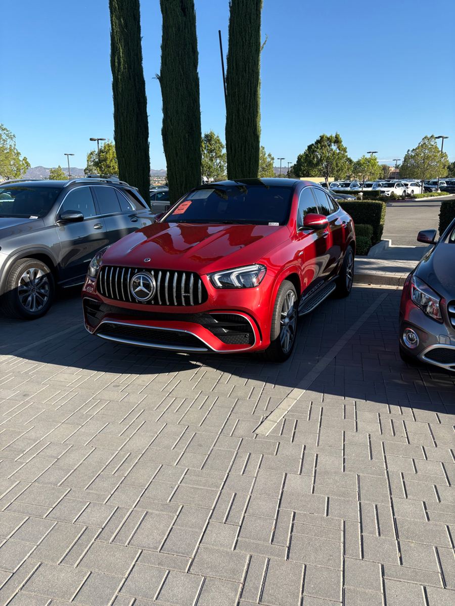 Red Mercedes-AMG GLE coupe parked on a dealer lot