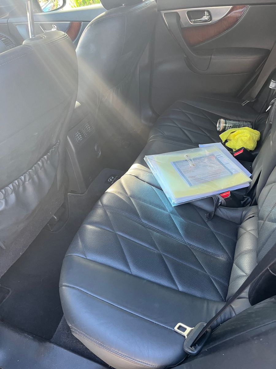 Rear leather seats and door trim inside an SUV
