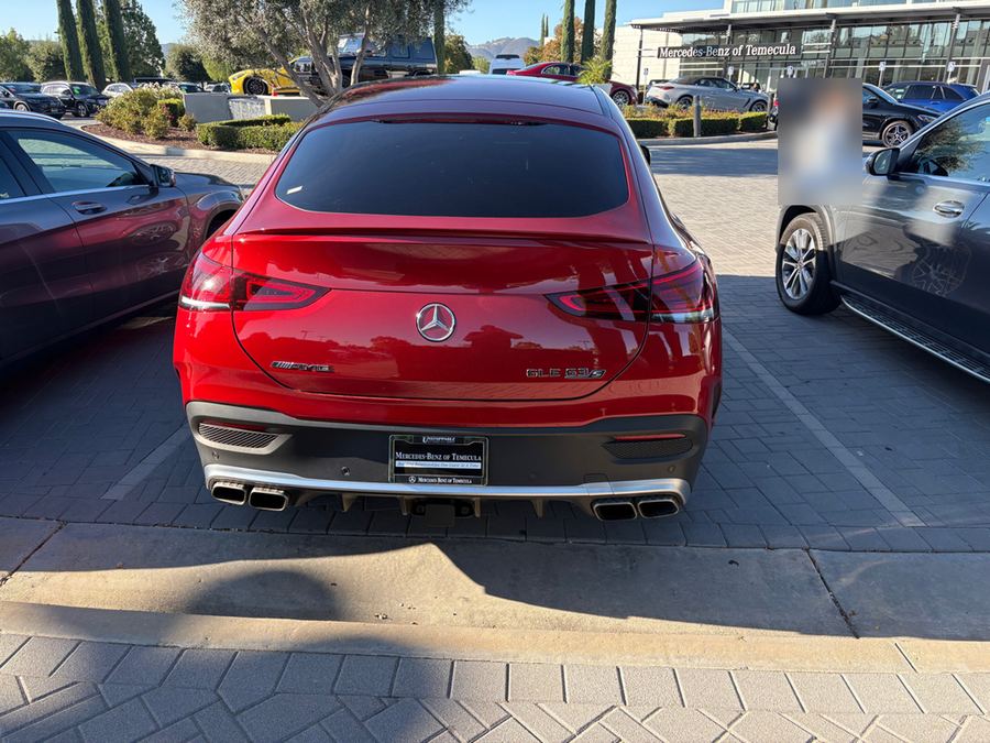 Rear of a red Mercedes-AMG GLE 53 coupe with quad exhaust tips