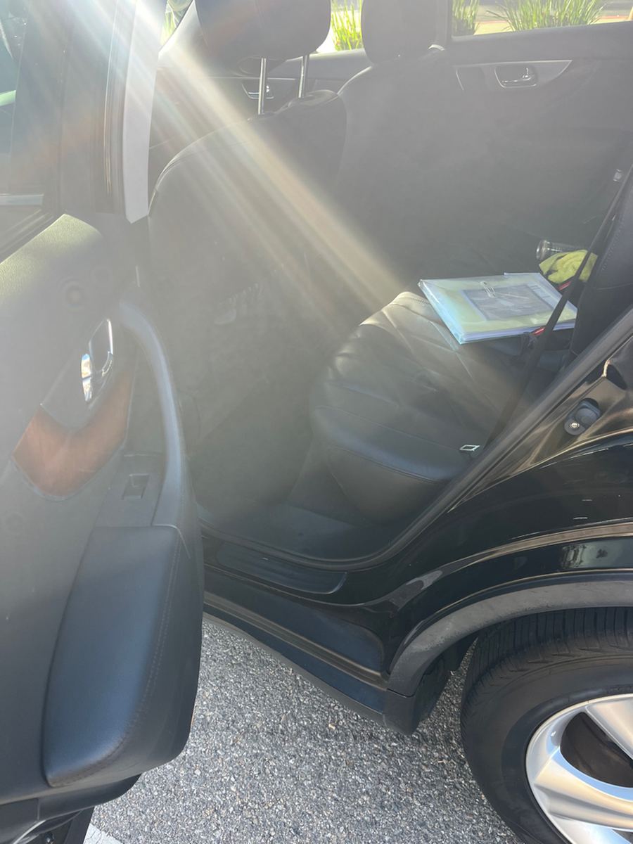 Rear seat and footwell of an Infiniti FX35 through the open back door