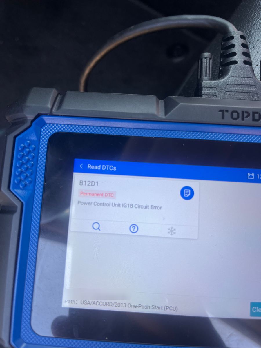 A TOPDON scan tool showing a permanent fault code B12D1, power control unit circuit error, on a 2013 Honda Accord, VIN blurred out