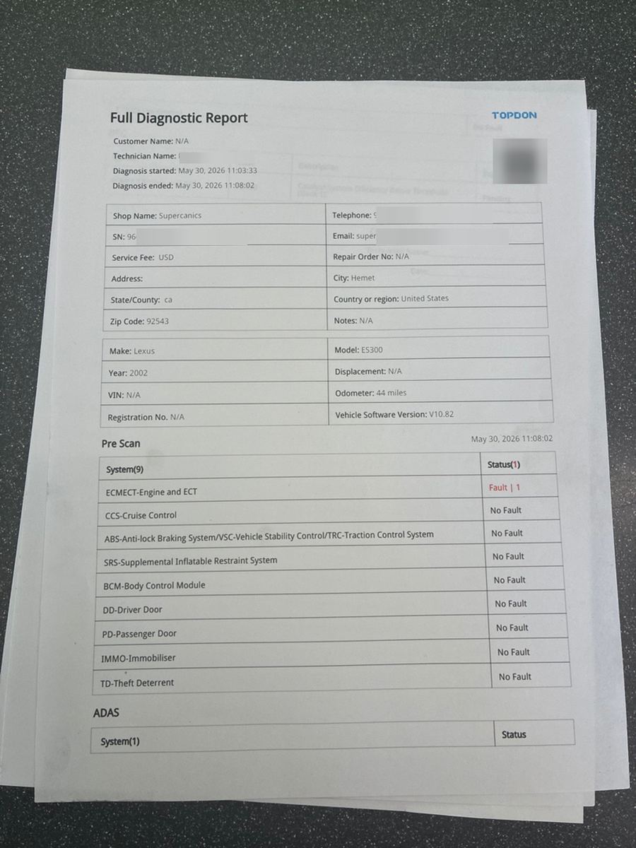 A TOPDON full diagnostic report showing a pre-scan table of vehicle systems, one reading Fault and the rest No Fault