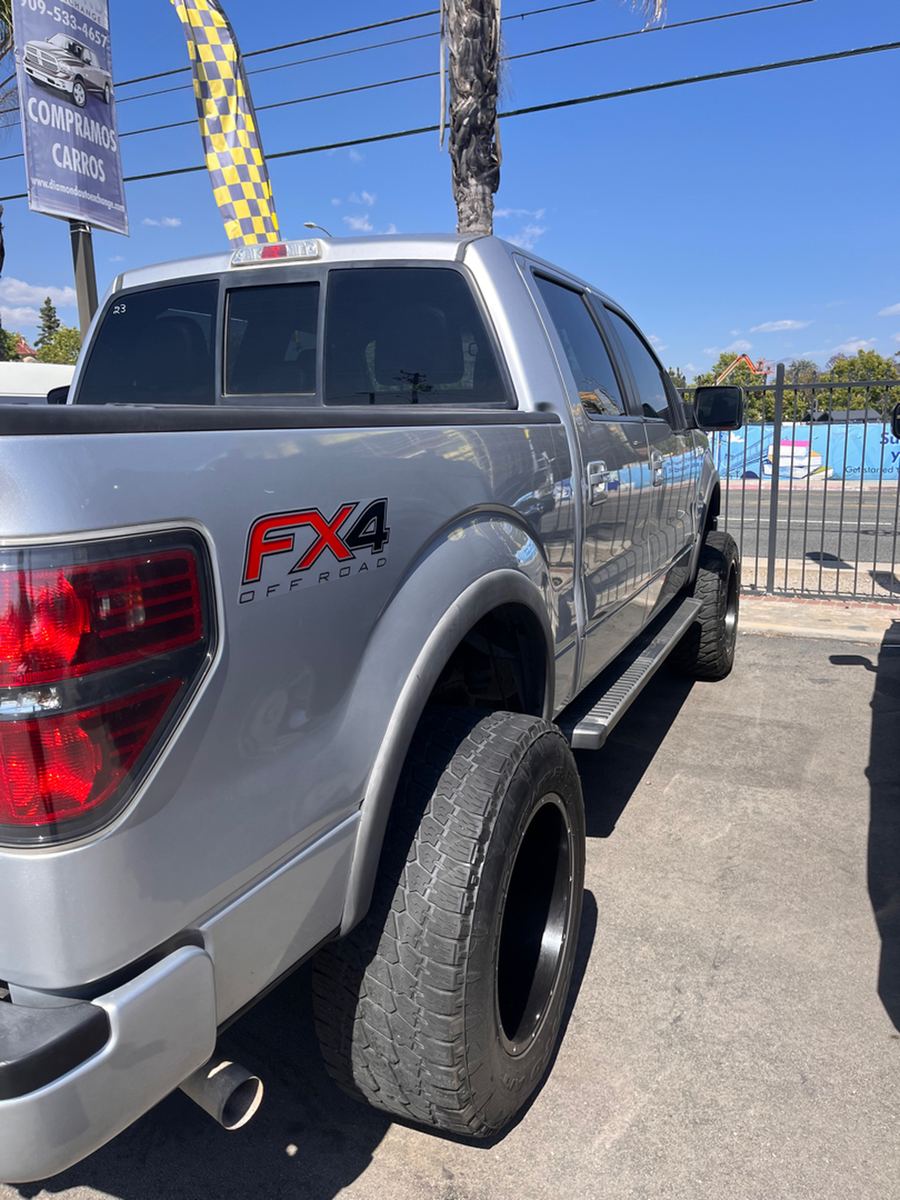 Rear three-quarter view of a silver F-150 FX4 pickup