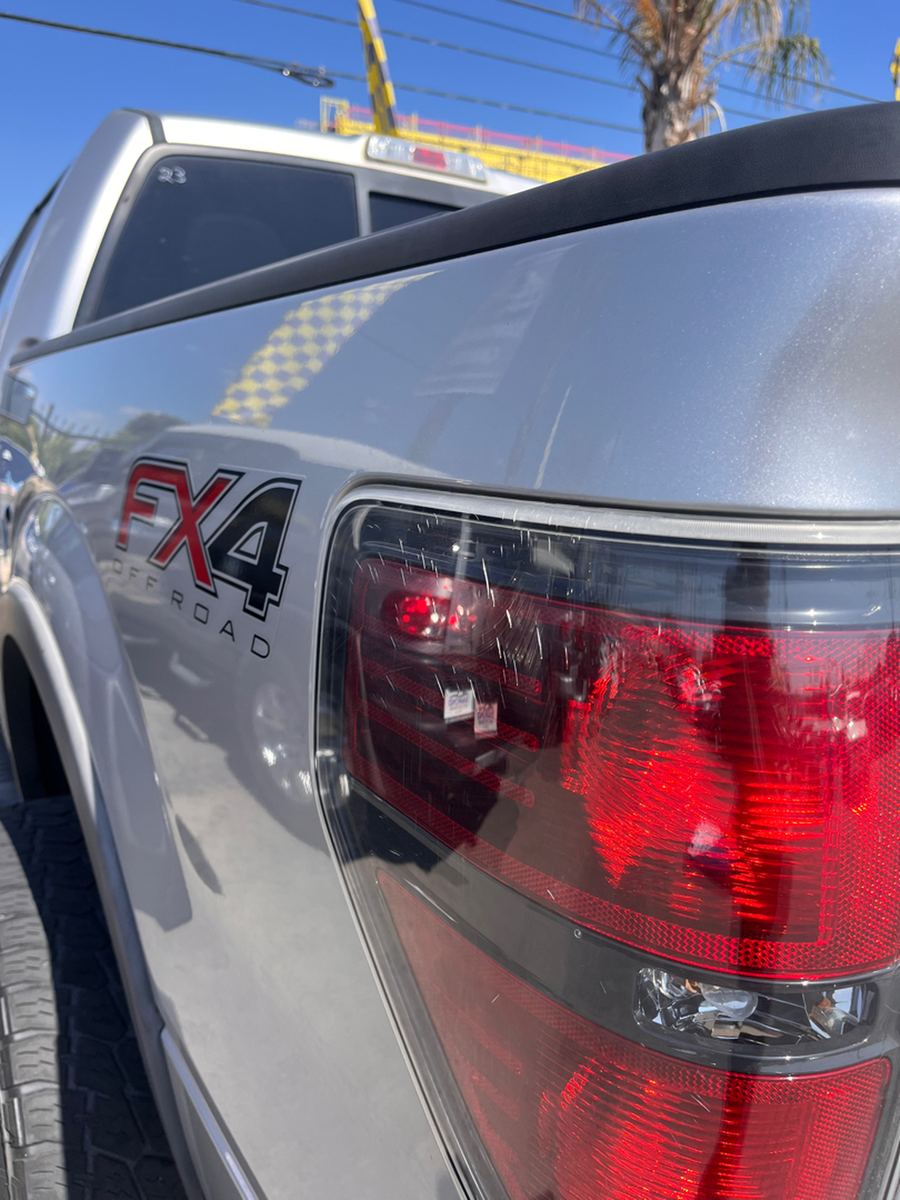 FX4 badge and tail light on the rear quarter of a silver pickup