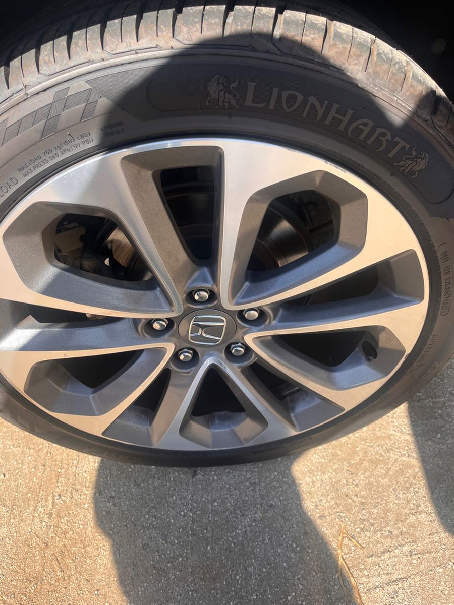 Alloy wheel and tyre sidewall photographed from the side