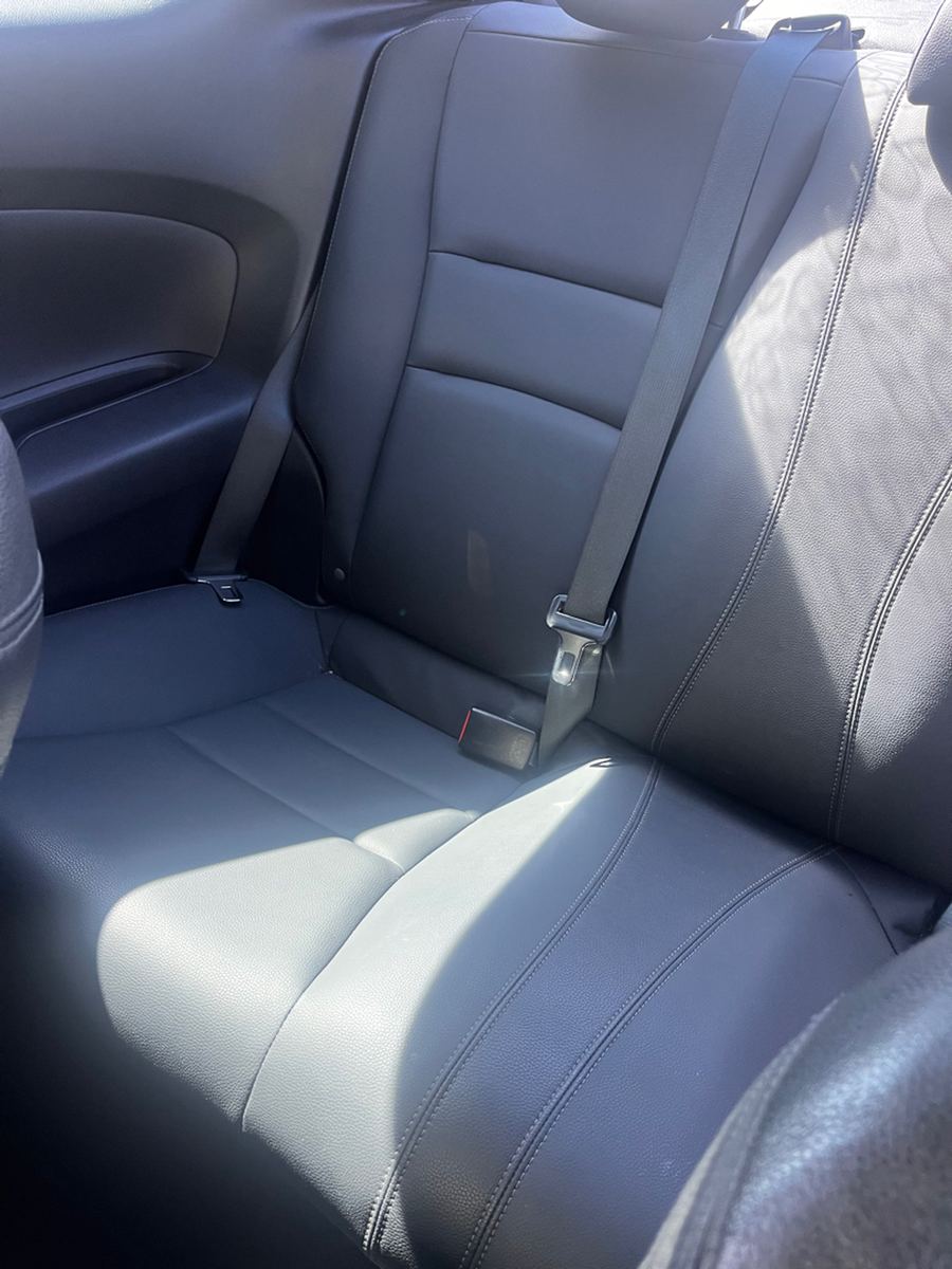 Rear seats, head restraints and belts inside a coupe