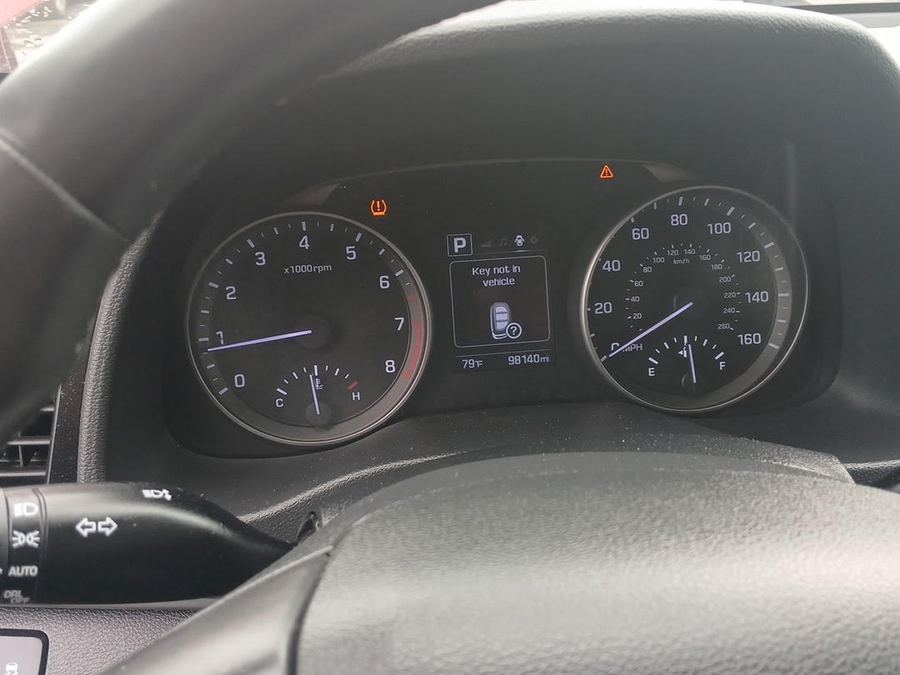 Hyundai instrument cluster showing the odometer and an amber tire pressure light