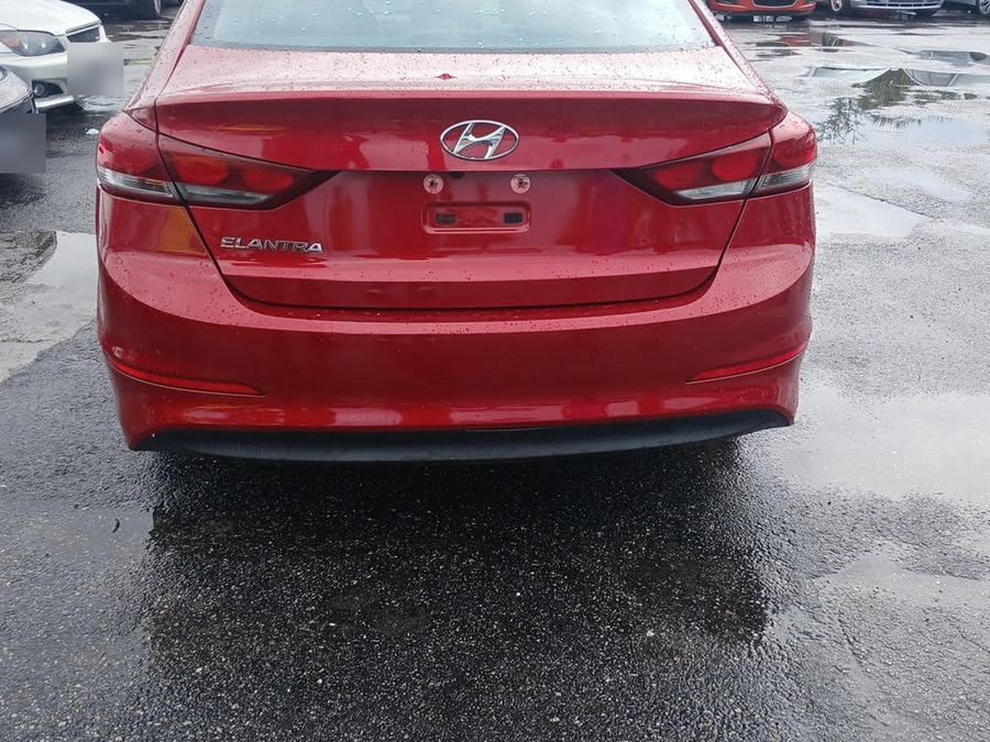 Rear of a red Hyundai Elantra with no license plate on it