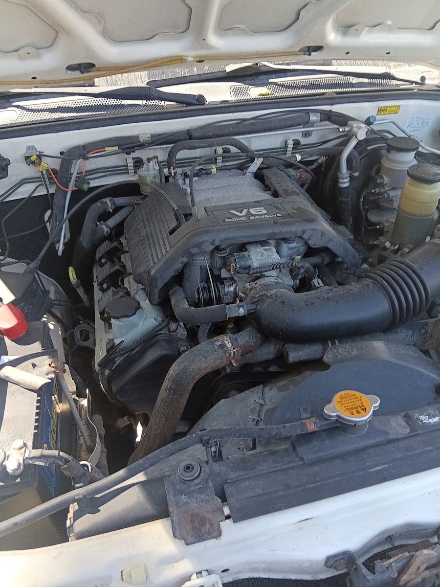 V6 engine bay of an Isuzu Rodeo with the hood up
