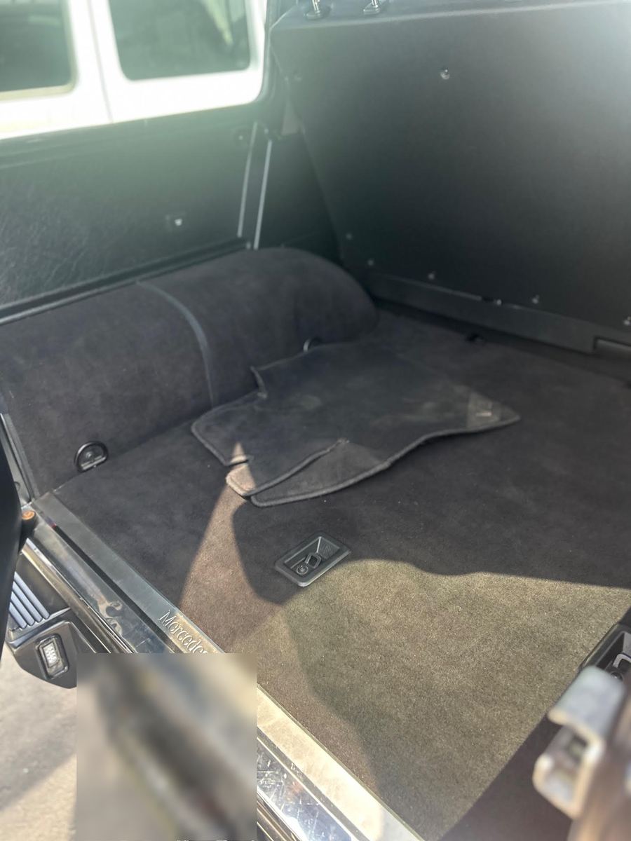 Carpeted cargo area of a G-Class with the rear door open