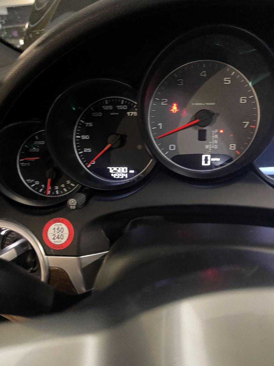 Porsche instrument cluster with the needles up and the engine running