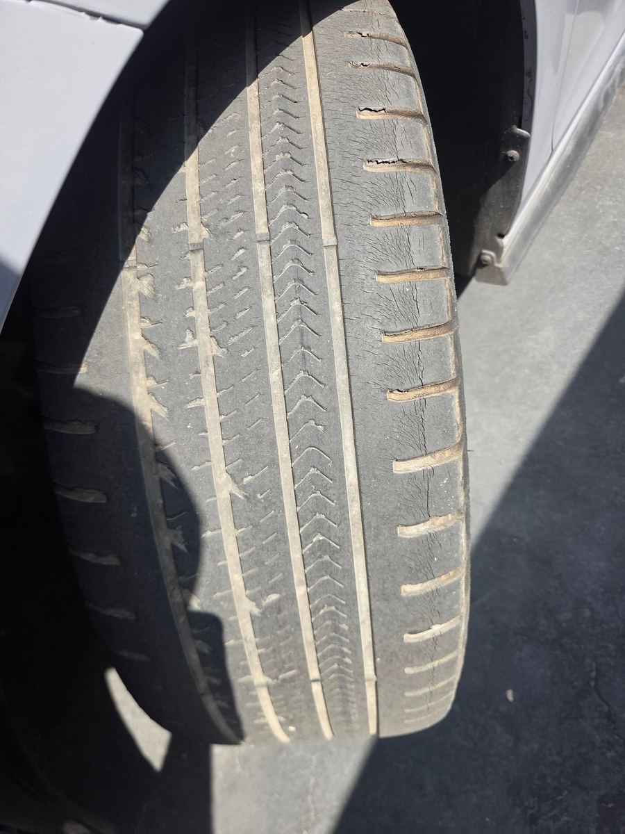 Front tire tread seen from the side of the car