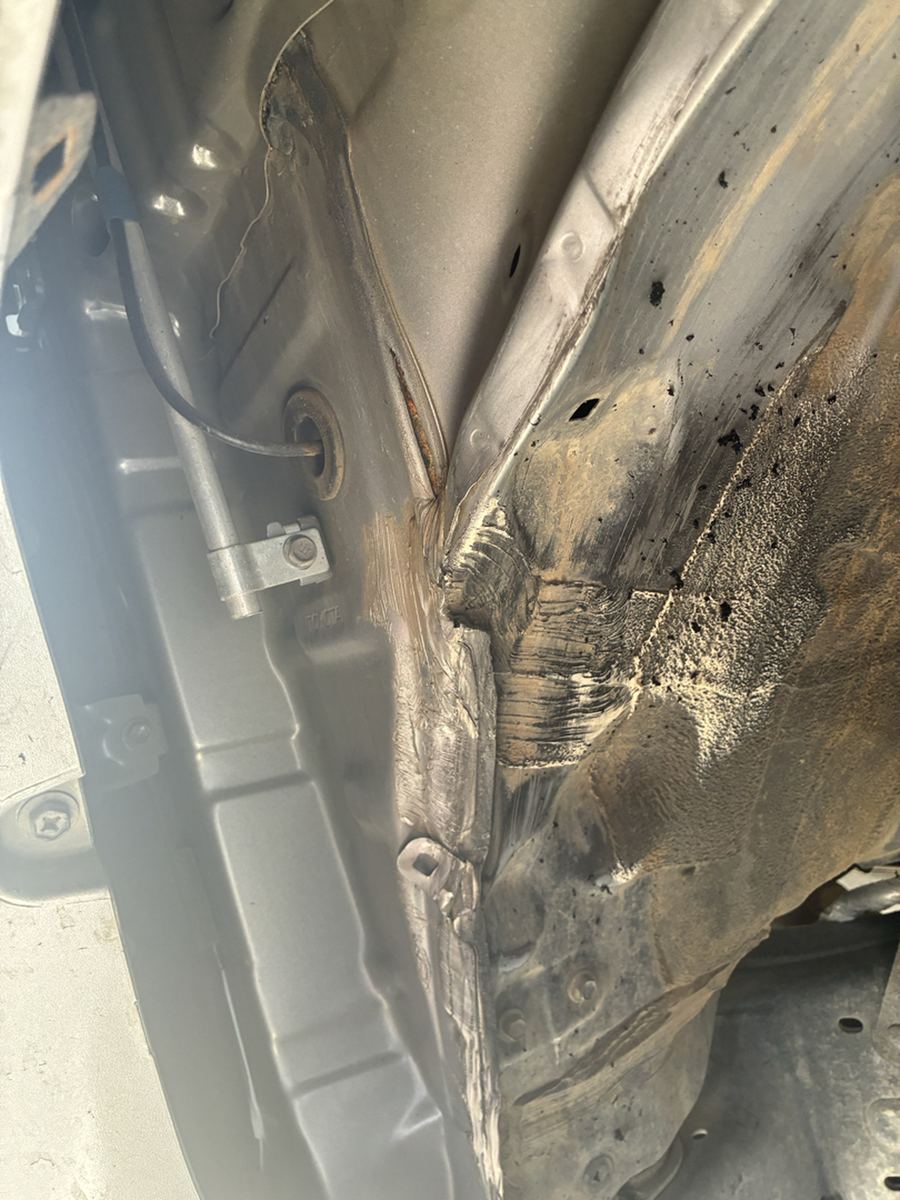 Rust where the rocker panel meets the cab corner of a pickup