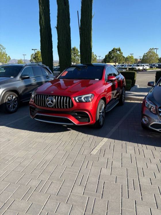 Red Mercedes-AMG GLE coupe parked on a dealer lot
