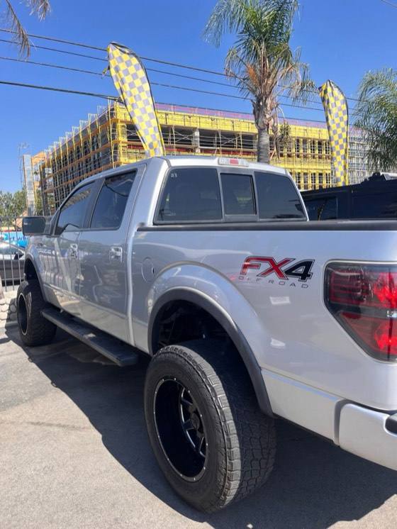 Silver Ford F-150 FX4 pickup photographed side-on in a parking lot
