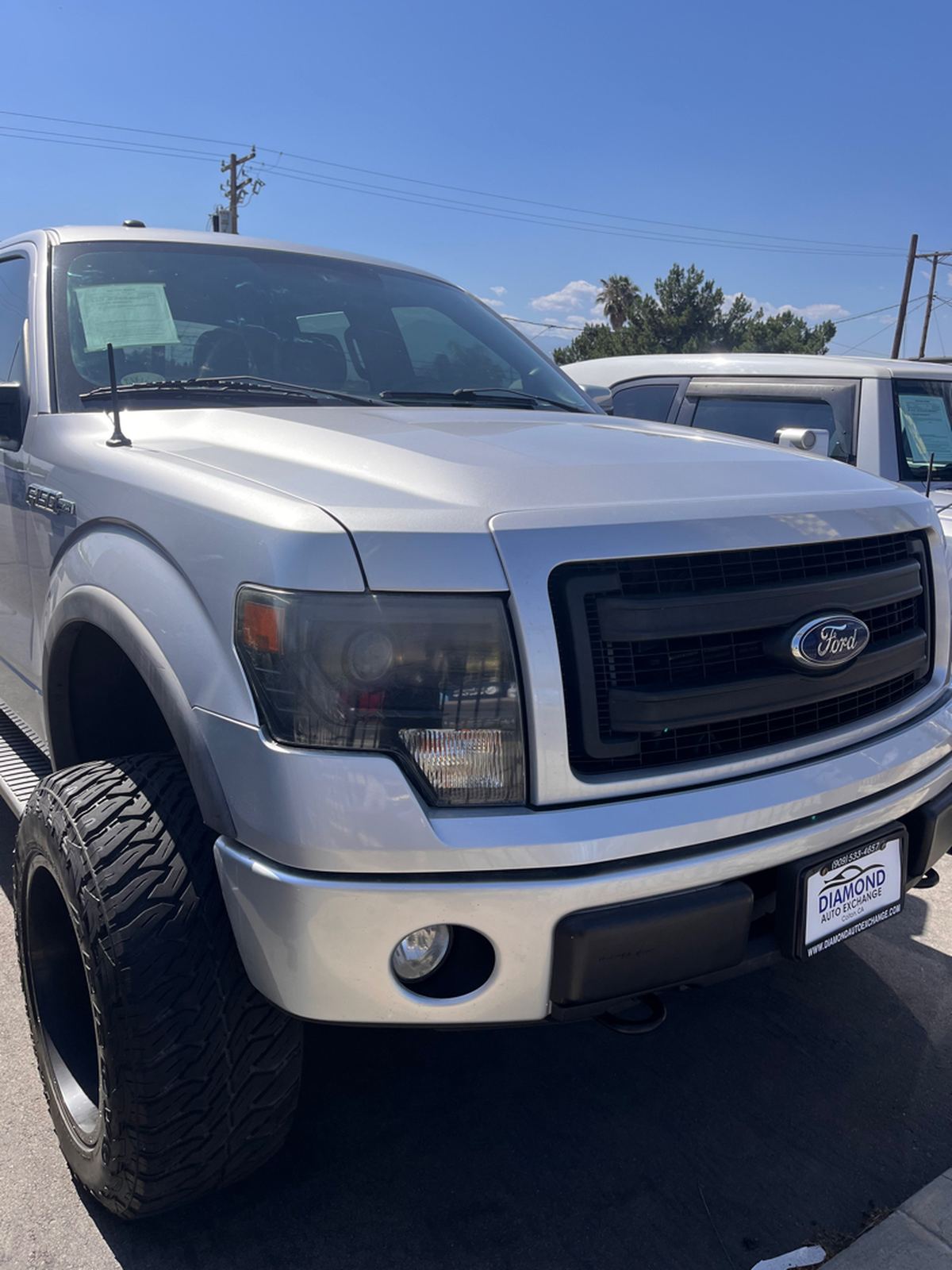 Silver Ford F-150 FX4 pickup photographed from the front corner